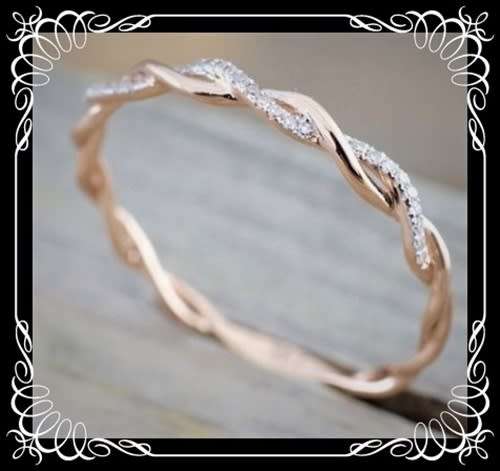 Lustrous 14K Gold plated rhinestone twist ring