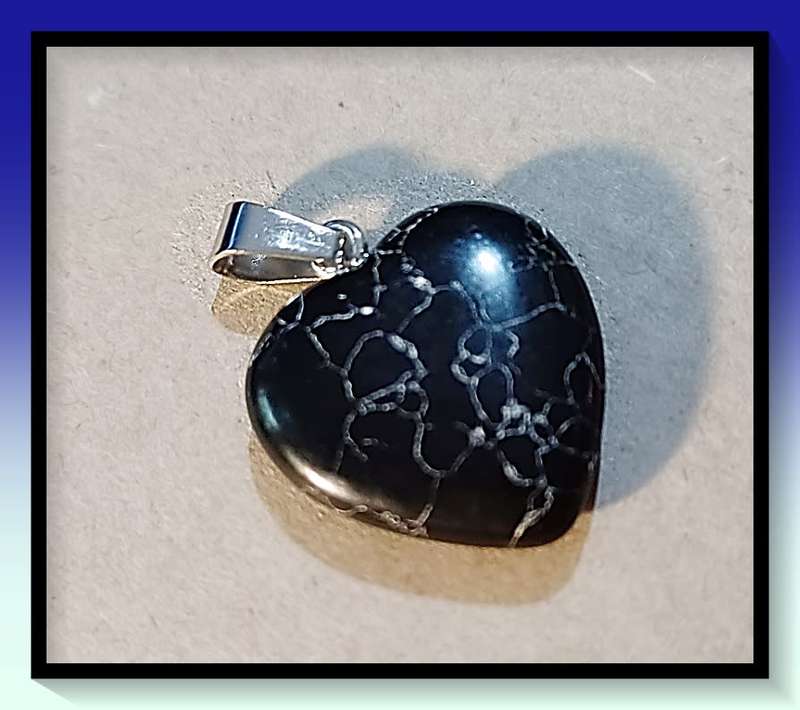 Interesting black and white marble look heart pendant on black cord Necklace