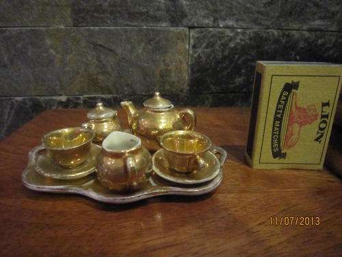 Miniature gold porcelain tea set