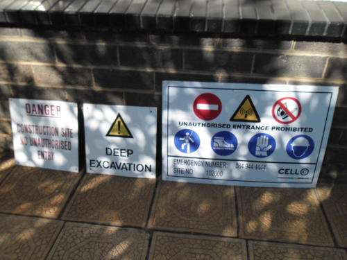 Three metal signs