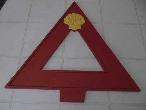 large cast aluminium triangle shell sign