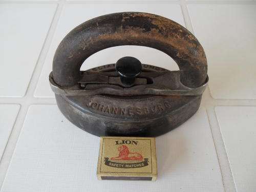 very old heavy metal with wooden clip off handle iron and stamped