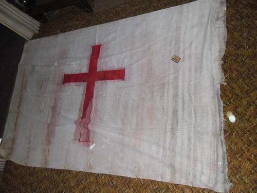 extra large old white flag with red cross very bad condition