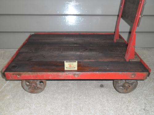 stunning vintage angle iron frame with cast wheels and wood platform bogie/trolley