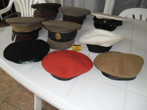 9 used caps and berets