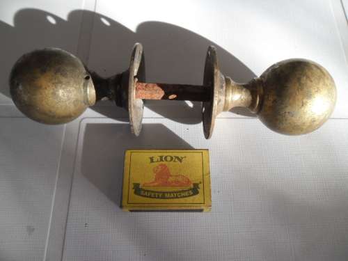 Pair of brass door knobs size is 200mm overall length see condition