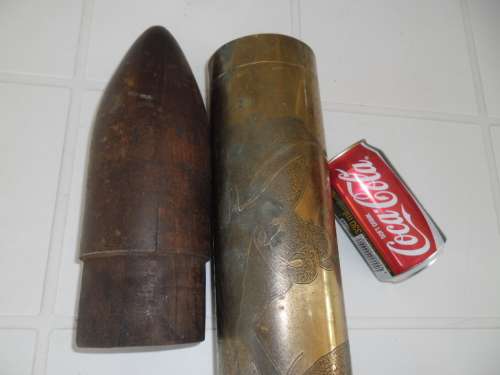 Brass and wood bullet shape display item size is 660mm long postnet postage R140
