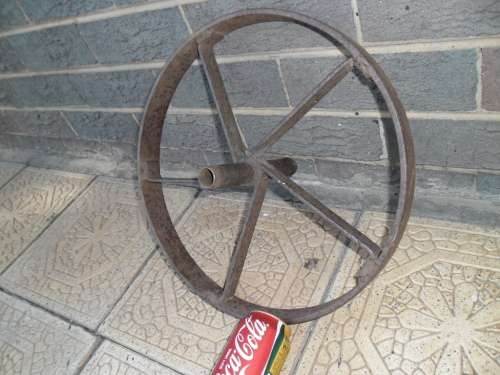 Very old wheel barrow metal wheel only postage is R100