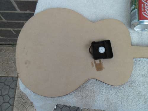 Large Elvis Presley guitar clock not working need new clock size is 755mm long postage is R95