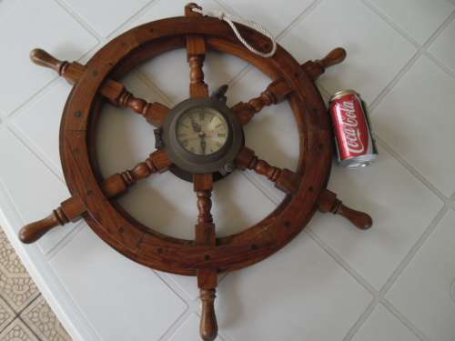 Center brass Porthole with clock working and wood ships wheel add to your order postnet postage R220