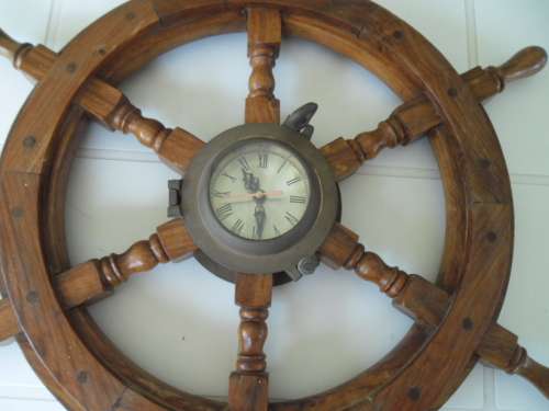 Center brass Porthole with clock working and wood ships wheel add to your order postnet postage R220