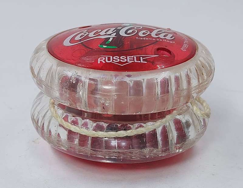 YoYo SUPER RUSSELL Coca Cola, with internal LEDs that light up Trademarks regd.1999