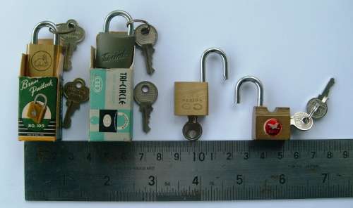 Collection of 11 miniature padlocks with keys