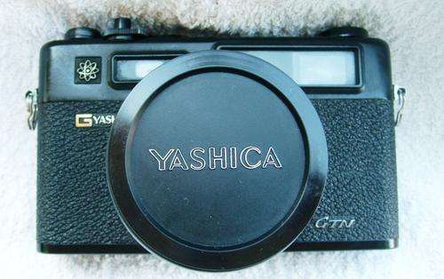 Vintage black YASHICA electro 35 camera with tripod