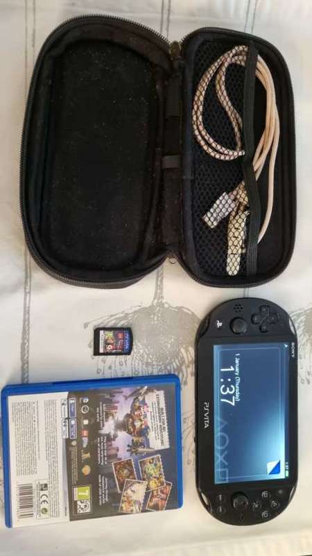 PS Vita / PSVita 2000 + LEGO Movie Videogame + Carry Pouch