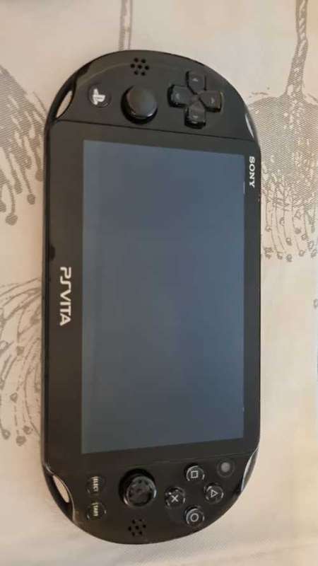 PS Vita / PSVita 2000 + LEGO Movie Videogame + Carry Pouch