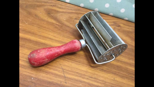 Vintage Koeksister Cutter with red wooden handle