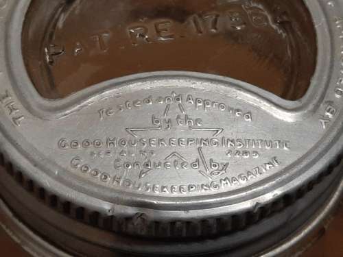 Vintage Glass Bottle / Jar with interesting lid - See pictures