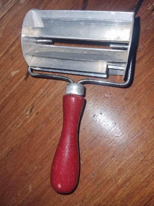 Vintage Koeksister cutter with wooden handle