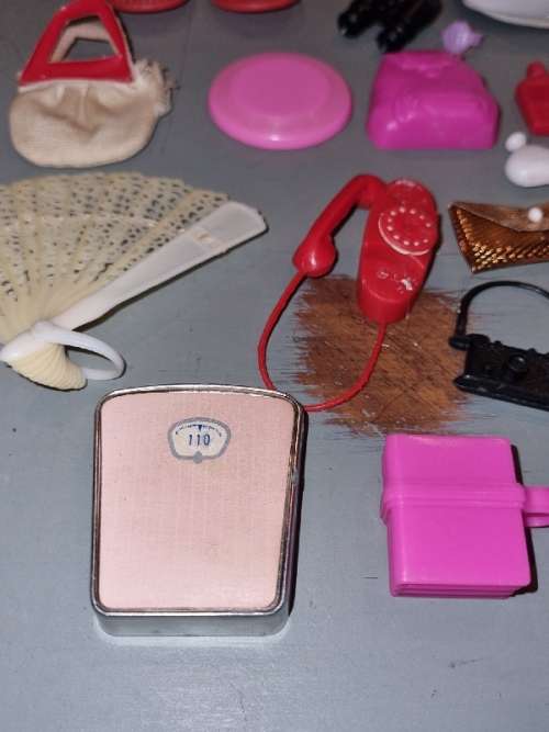 Barbie accessories including Bags, telephone, watch, helmet, camera, scale, etc.