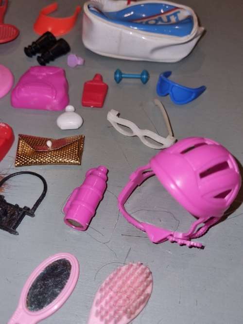 Barbie accessories including Bags, telephone, watch, helmet, camera, scale, etc.