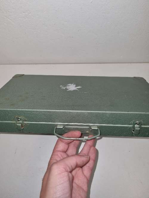 Lots of vintage slides in metal container