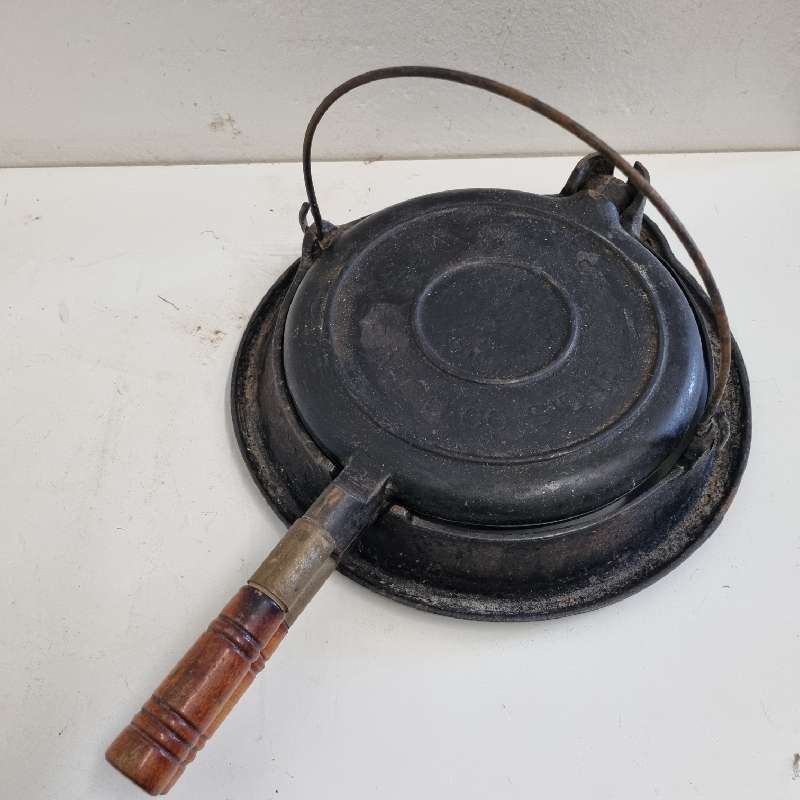 Vintage Wagner Cast Iron Waffle Maker on stand