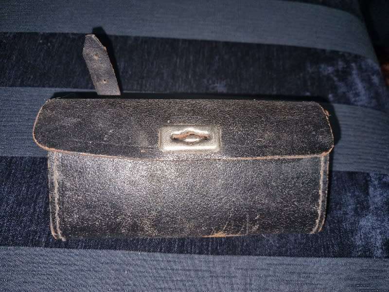 Antique Leather Bicycle Tool Bag with some old tools