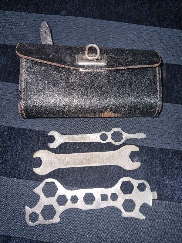 Antique Leather Bicycle Tool Bag with some old tools