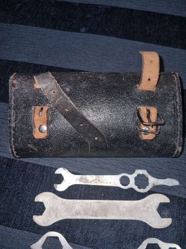Antique Leather Bicycle Tool Bag with some old tools