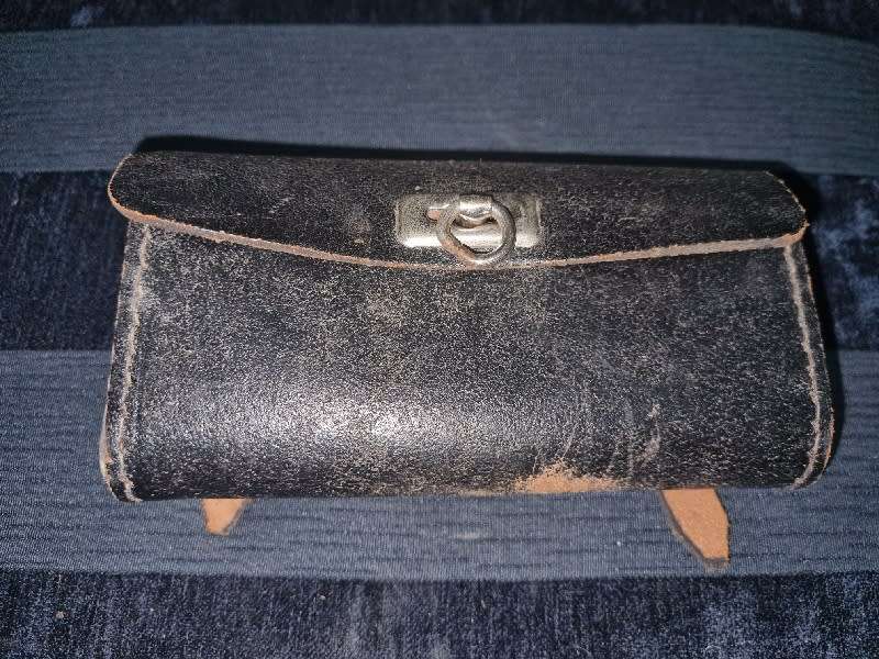 Antique Leather Bicycle Tool Bag with some old tools