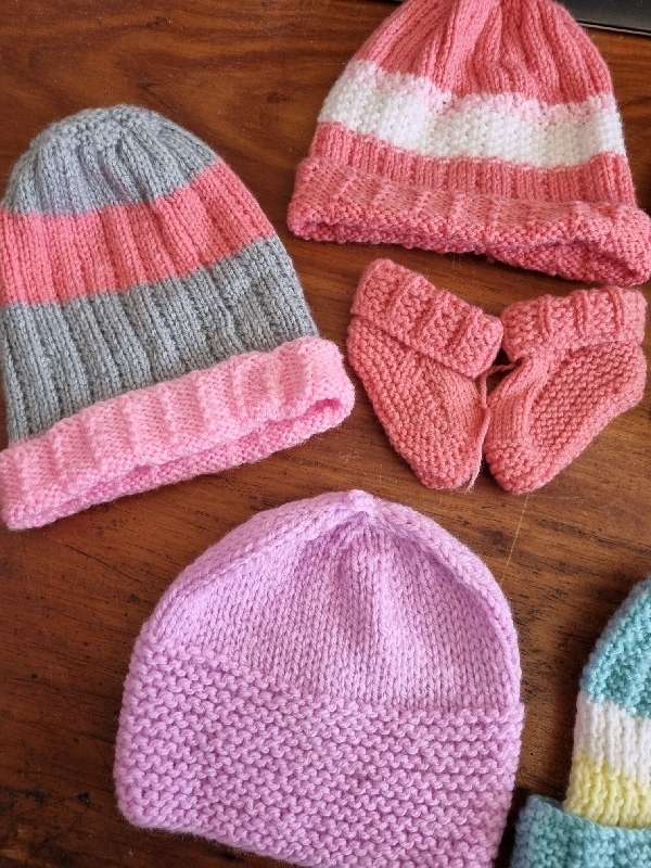 5 x Knitted baby hats and 2 pairs of booties - New