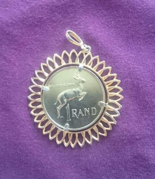 Gold plated 1967 silver one rand in pendant.