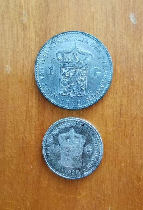 1930 silver nederland one gulden and 1928 nederland half gulden.