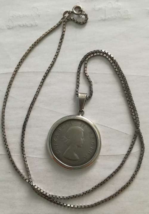 1957 silver two shillings with a sterling silver pendant.