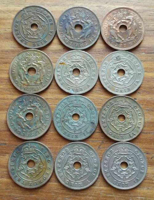 Collection of 12 Rhodesia Penny`s. One bid takes all.