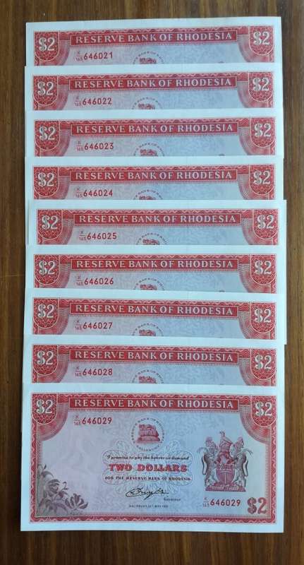 Rhodesia Salisbury 9 consecutive number bird watermark UNC-AUNC two dollar bank notes. Nice collecti