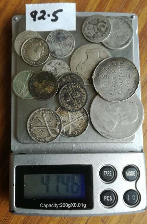 Collection of 35 silver coins from around the world. 122.69 grams.