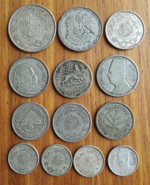 Collection of 13 Silver Middle Eastern coins. One bid takes all.