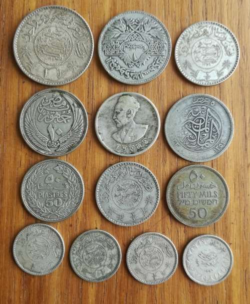 Collection of 13 Silver Middle Eastern coins. One bid takes all.