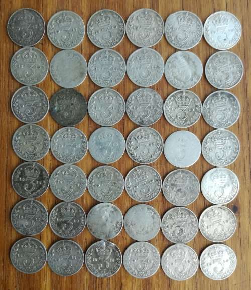 Great Britain collection of 42 Sterling silver three pence coins. 56.91 grams.