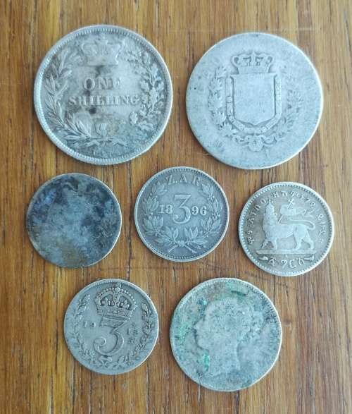 Collection of 7 old Silver coins from around the world.