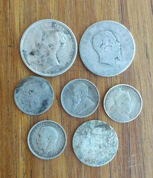Collection of 7 old Silver coins from around the world.