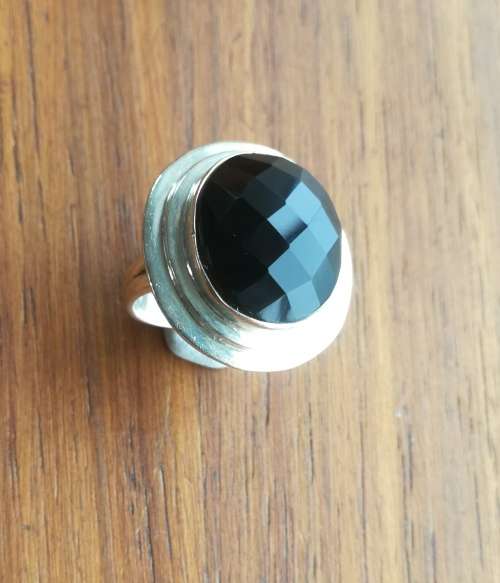 Beautiful sterling silver ladies ring with black stone.