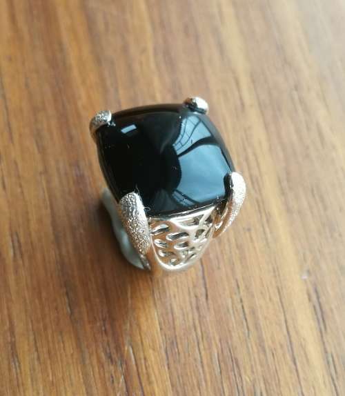 Beautiful sterling silver ladies ring with black stone.
