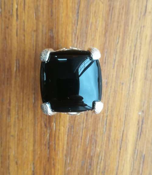 Beautiful sterling silver ladies ring with black stone.
