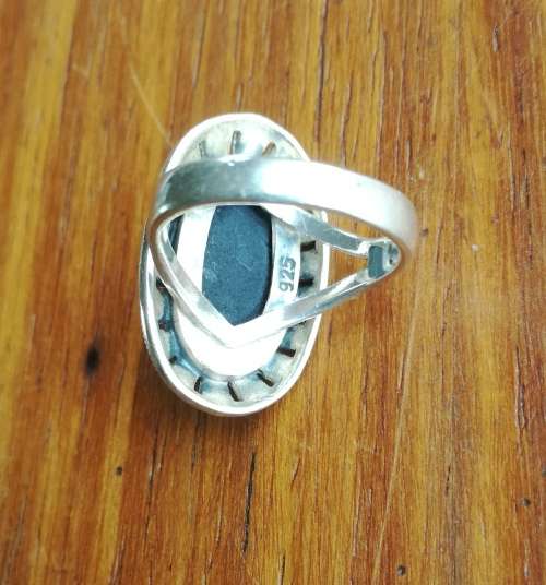 Beautiful sterling silver ladies ring with black stone.