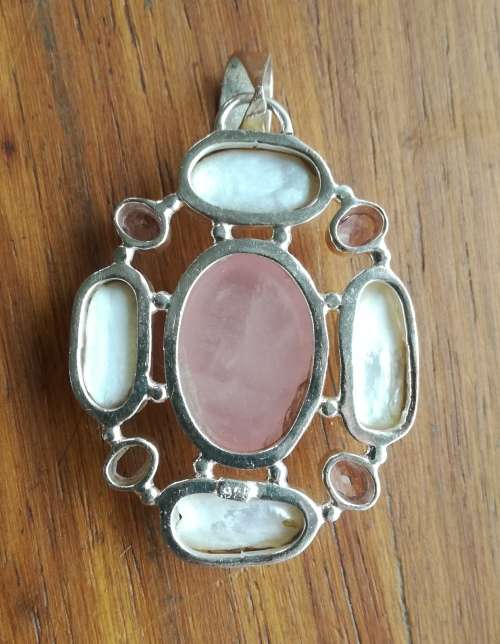 Beautiful sterling silver ladies pendant with stones.