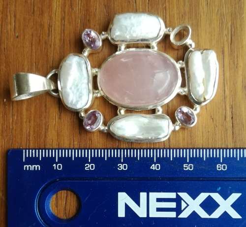 Beautiful sterling silver ladies pendant with stones.