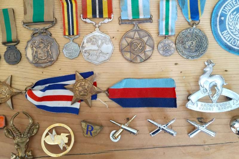 Large collection of military medals, badges and clothing. Please read.